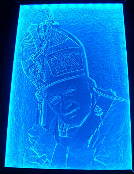 The Relief 3-D Engraving showing Pope John Paul II with a blue light-source from the side