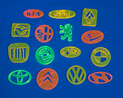 A selection of laser cut car logos