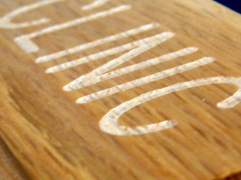 A detail of a clean-cut engraving in Oak