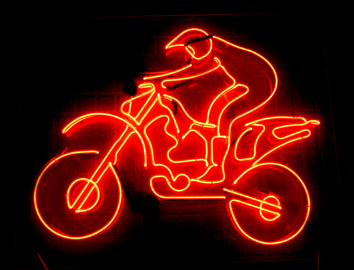 A Motorcyclist made up of Clear Red Glass Tubing